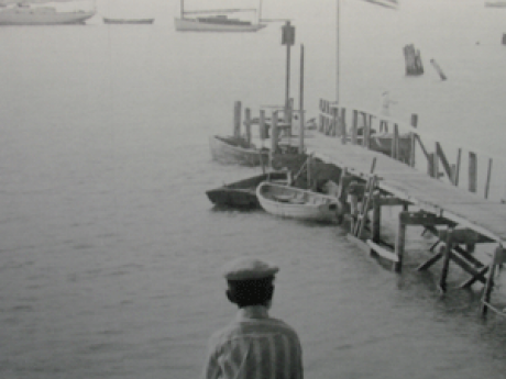 Northport Harbor Mural showing a boy looking down at the harbor circa 1910